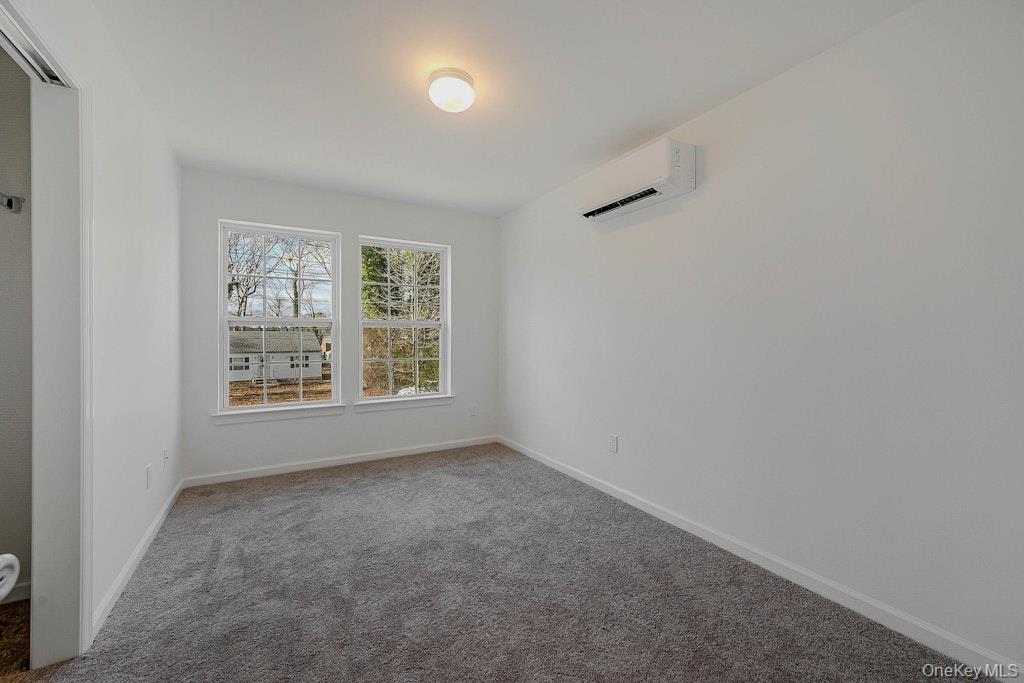New Construction Neighborhood Road Mastic Beach, NY 11951 - Photo 22 of 28 an empty room with a window