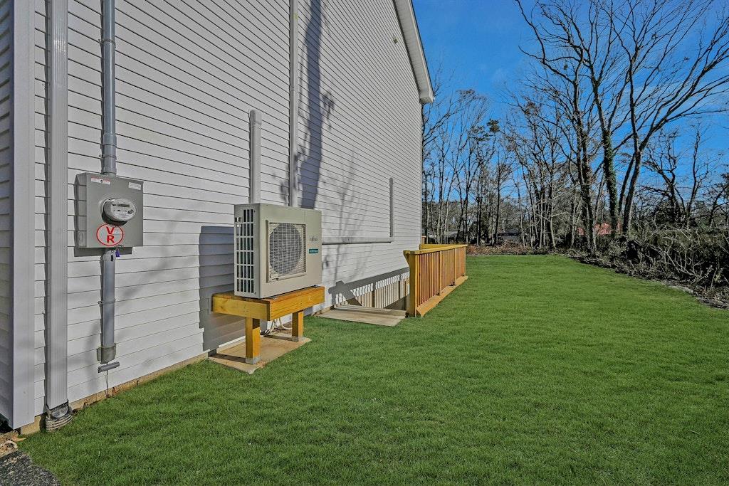 New Construction Neighborhood Road Mastic Beach, NY 11951 - Photo 26 of 28 a backyard of a house with table and chairs