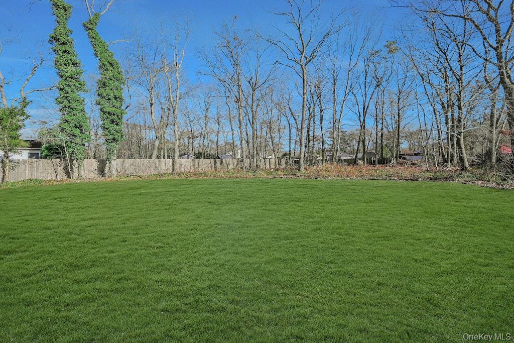 New Construction Neighborhood Road Mastic Beach, NY 11951 - Photo 27 of 28 a backyard of a house with lots of green space