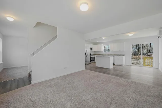 a view of a kitchen with a sink and cabinets