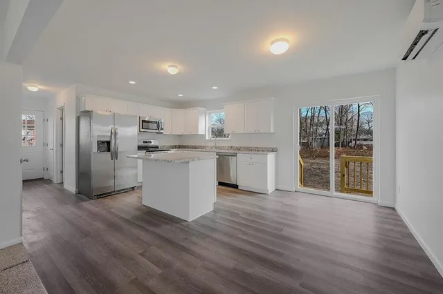 a view of kitchen with wooden floor