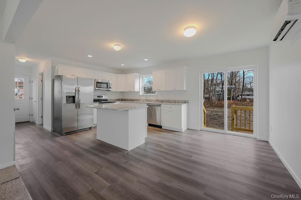 New Construction Neighborhood Road Mastic Beach, NY 11951 - Photo 4 of 28 a view of kitchen with wooden floor