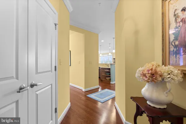 a view of a street sign under a large tree