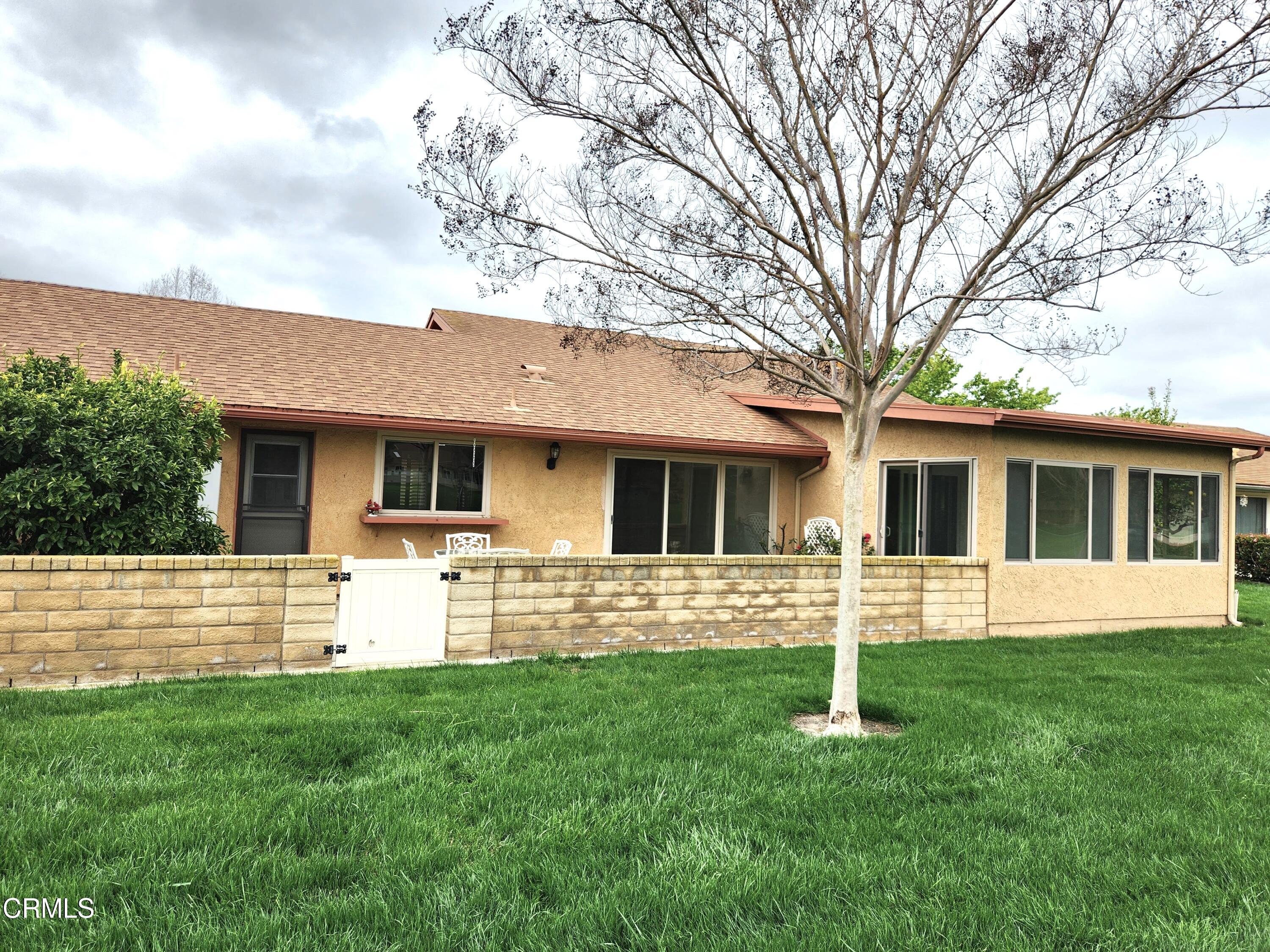 4113 Village 4 Camarillo, CA 93012 - Photo 21 of 50 a front view of house with yard and green space