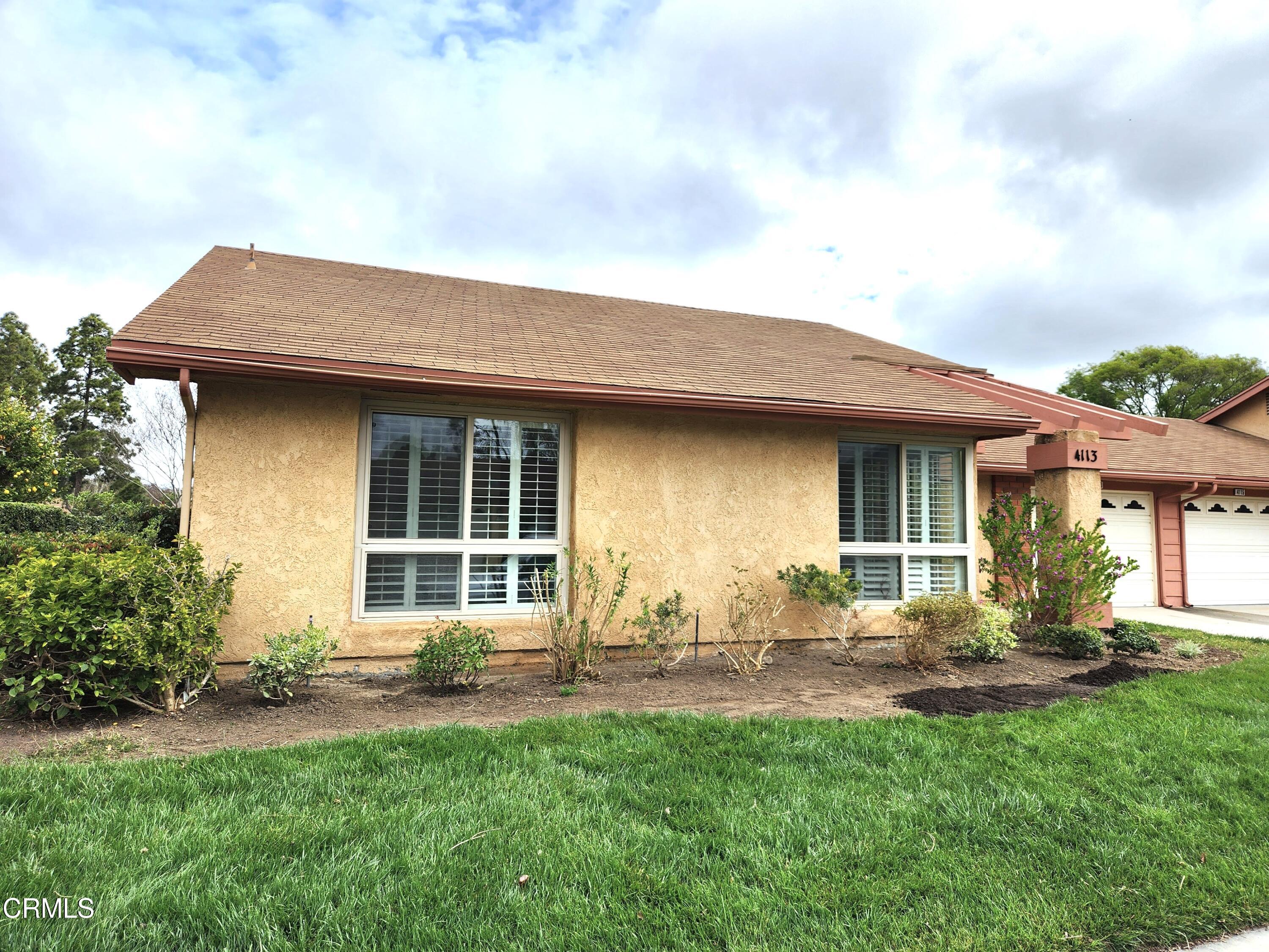 4113 Village 4 Camarillo, CA 93012 - Photo 3 of 50 a front view of a house with a yard