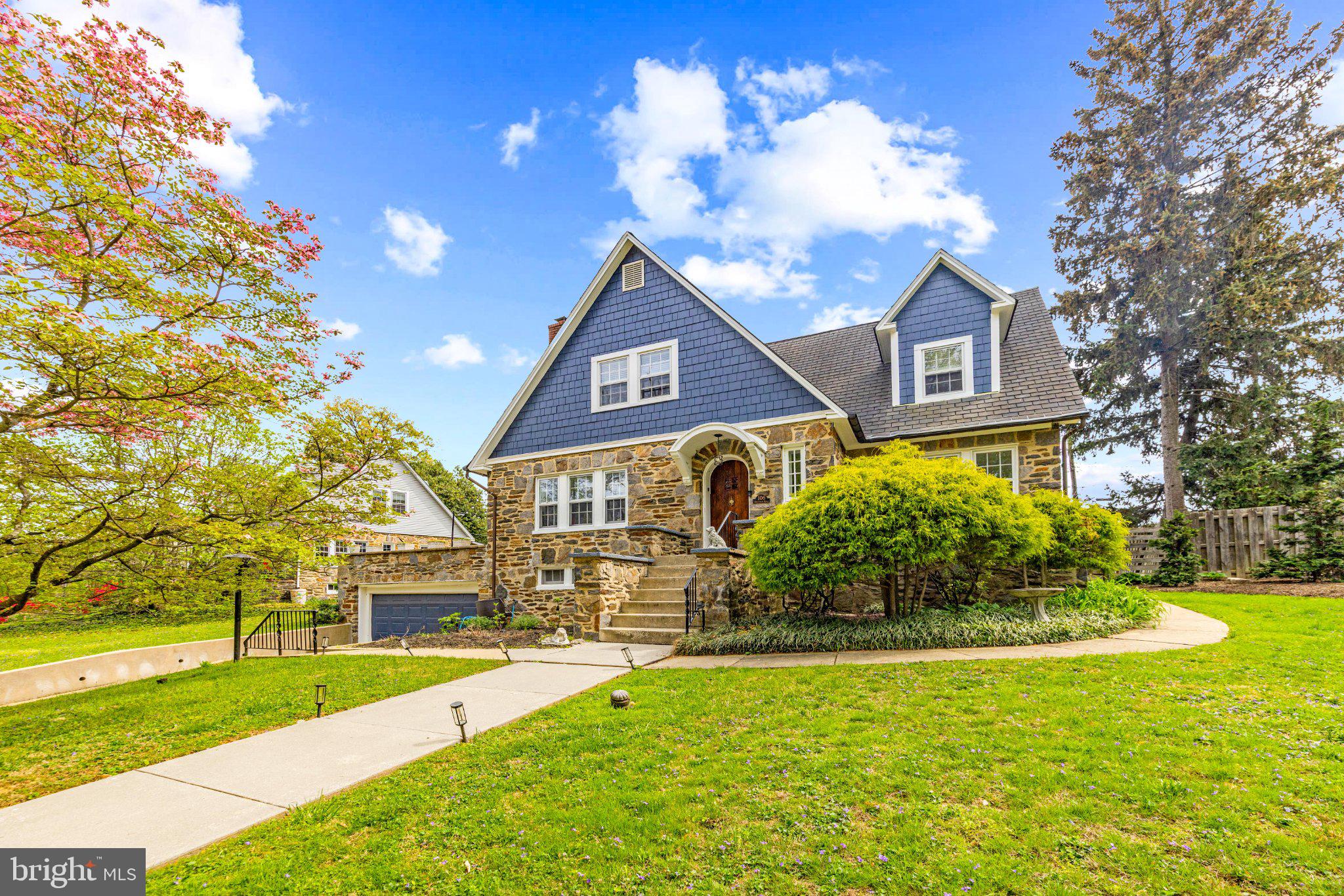 106 Edgewood Road Baltimore, MD 21286 - Photo 2 of 42 Charming stone home with lush greenery.