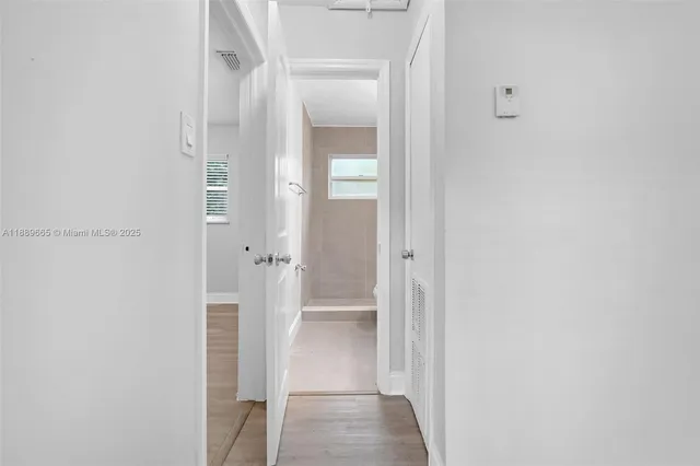 a view of a bathroom with a glass door