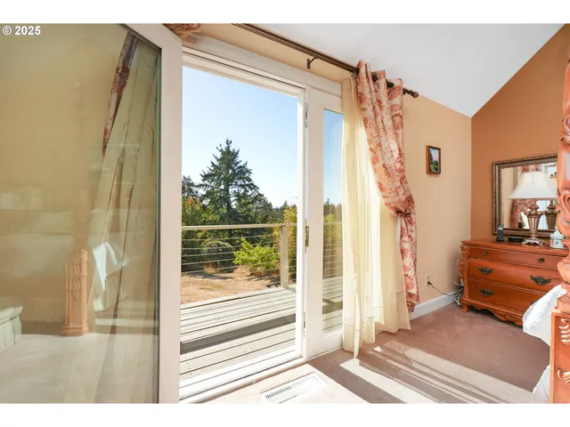 a bedroom with a bed and a mirror