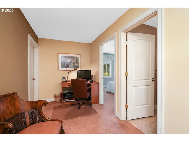 a livingroom with furniture and a workspace