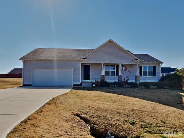 a front view of a house with yard