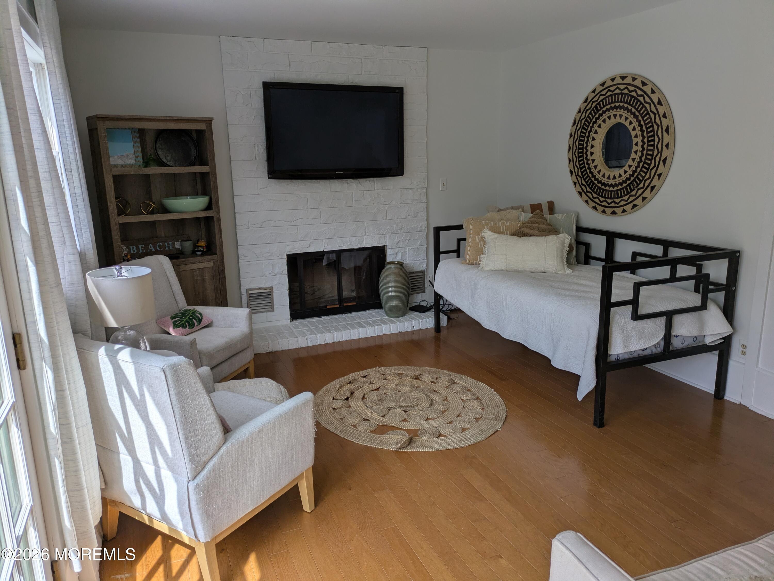 2113 Edgewood Place Spring Lake, NJ 07762 - Photo 5 of 7 a living room with furniture and a fireplace