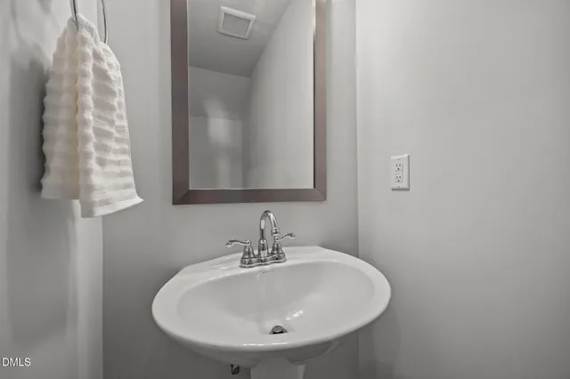 a living room with furniture and a ceiling fan