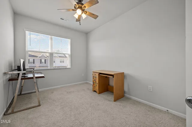 a view of a room with a large window