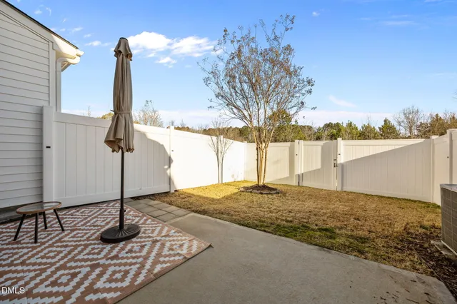 a view of a backyard of the house