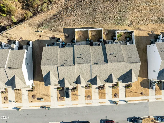 an aerial view of residential house with parking space