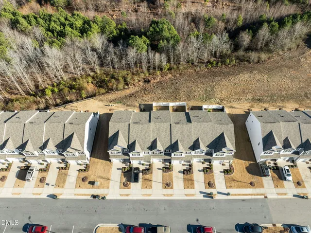 a view of a house with more wooden fence