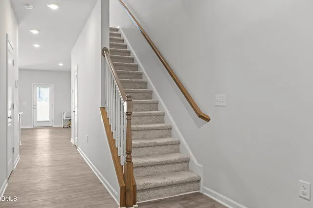a view of a hallway with stairs