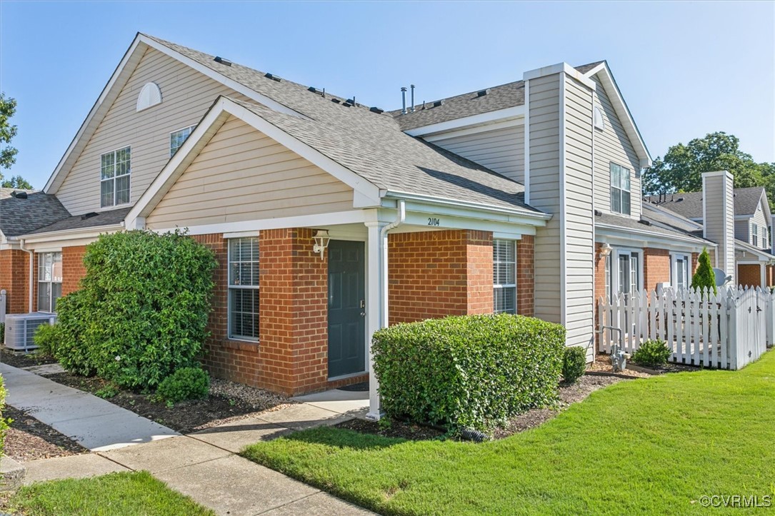 a view of a house with a yard and plants