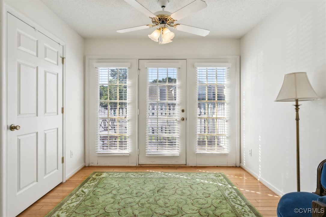 2104 Westgate Circle Williamsburg, VA 23185 - Photo 11 of 45 a view of an empty room with window and a chandelier fan