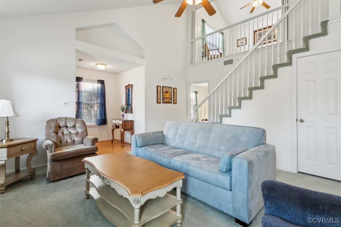 2104 Westgate Circle Williamsburg, VA 23185 - Photo 18 of 45 a living room with furniture and a chandelier