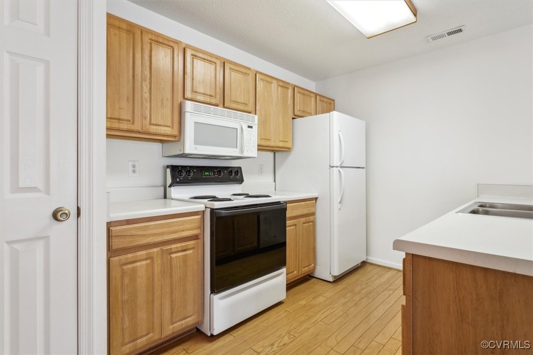 2104 Westgate Circle Williamsburg, VA 23185 - Photo 21 of 45 a kitchen with stainless steel appliances a stove a microwave and refrigerator