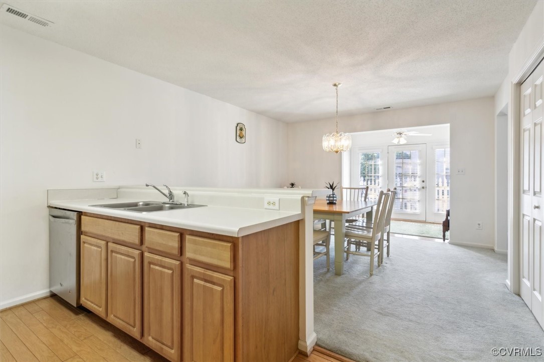 2104 Westgate Circle Williamsburg, VA 23185 - Photo 22 of 45 a view of a a dining table chairs and bedroom with wooden floor