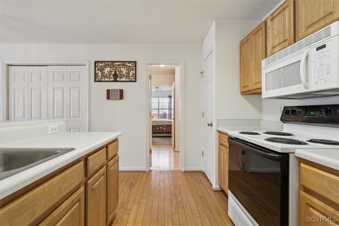 2104 Westgate Circle Williamsburg, VA 23185 - Photo 23 of 45 a kitchen with a stove and a sink
