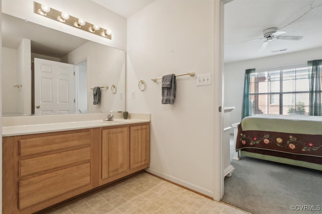 2104 Westgate Circle Williamsburg, VA 23185 - Photo 26 of 45 a bathroom with a tub a double vanity sink and a mirror