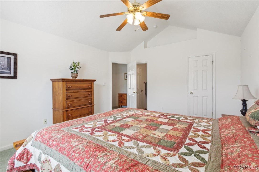 2104 Westgate Circle Williamsburg, VA 23185 - Photo 31 of 45 a bedroom with a bed and a chandelier
