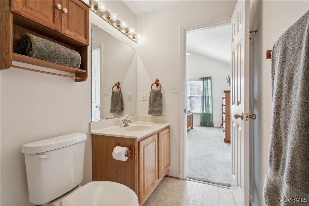 2104 Westgate Circle Williamsburg, VA 23185 - Photo 35 of 45 a bathroom with a toilet a sink and mirror