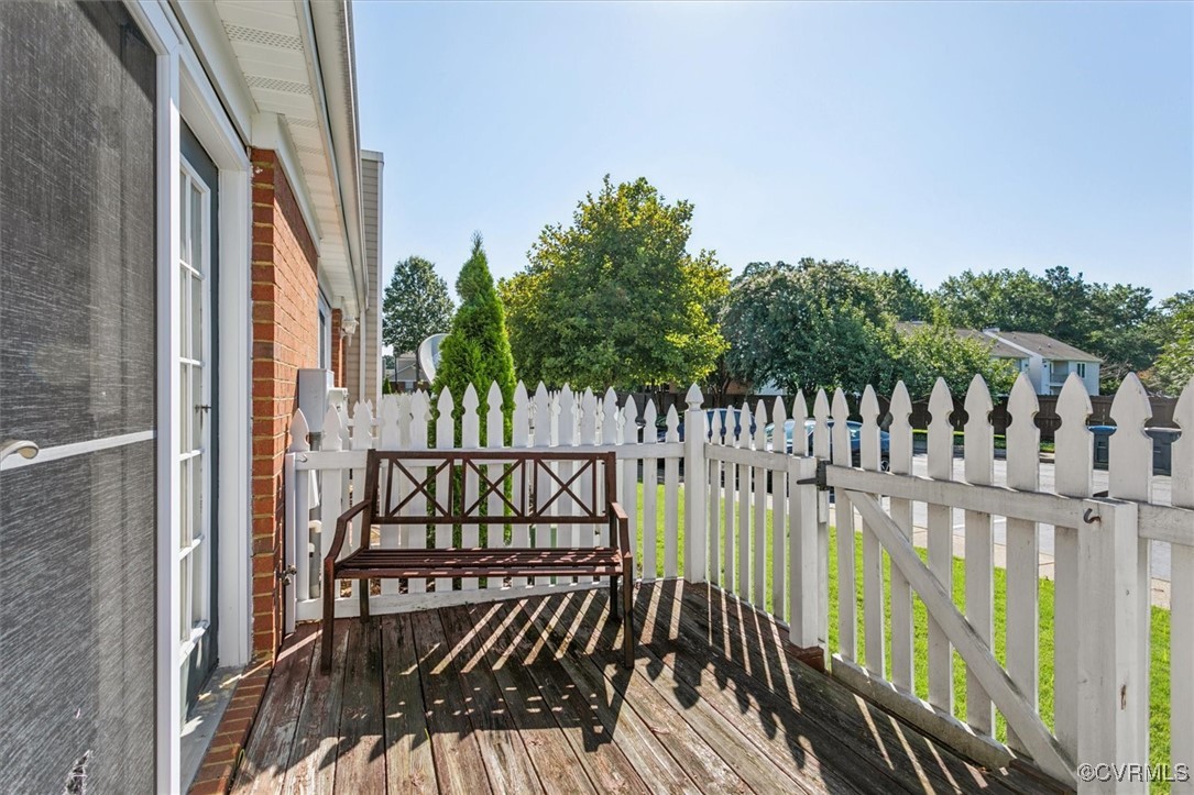 2104 Westgate Circle Williamsburg, VA 23185 - Photo 38 of 45 a view of balcony with wooden floor and fence