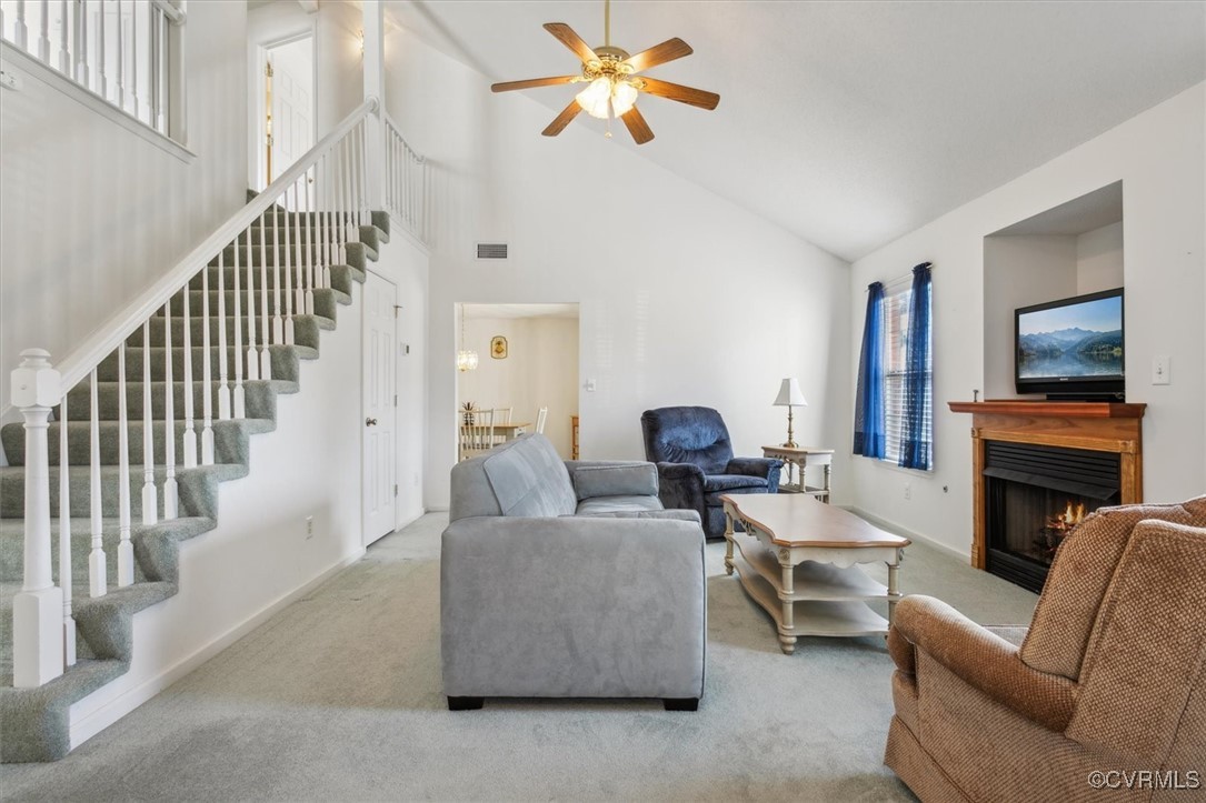 2104 Westgate Circle Williamsburg, VA 23185 - Photo 4 of 45 a living room with furniture a fireplace and a flat screen tv