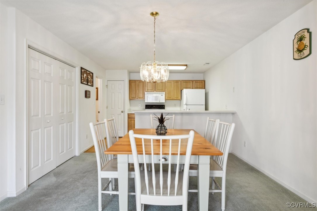 2104 Westgate Circle Williamsburg, VA 23185 - Photo 8 of 45 a view of a dining room with furniture and window