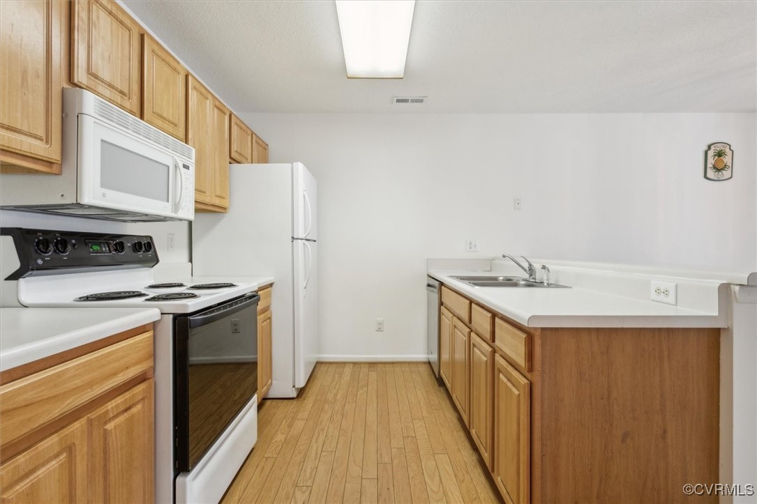 2104 Westgate Circle Williamsburg, VA 23185 - Photo 9 of 45 a kitchen with a sink stove and refrigerator