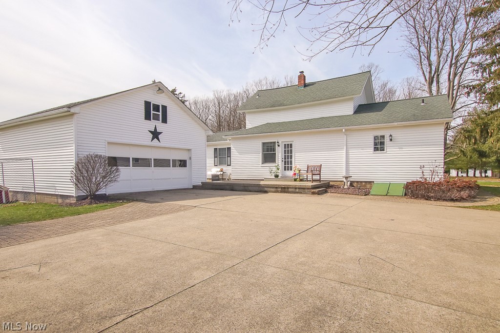 3589 Lester Road Medina, OH 44256 - Photo 23 of 35 2 car detached garage with large loft. Concrete driveway. Access to paver patio. Not shown - recently added backdoor pergola. Basement access door leads to a workshop.