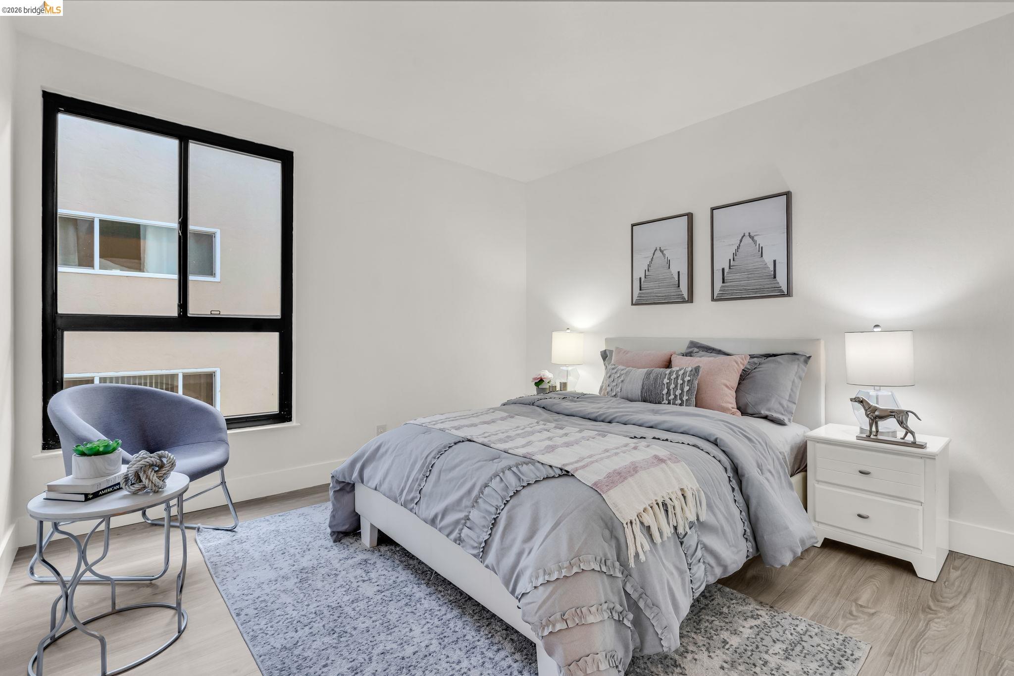 2632 Warring Street, Unit 3 Berkeley, CA 94704 - Photo 14 of 23 a bedroom with a bed and chair