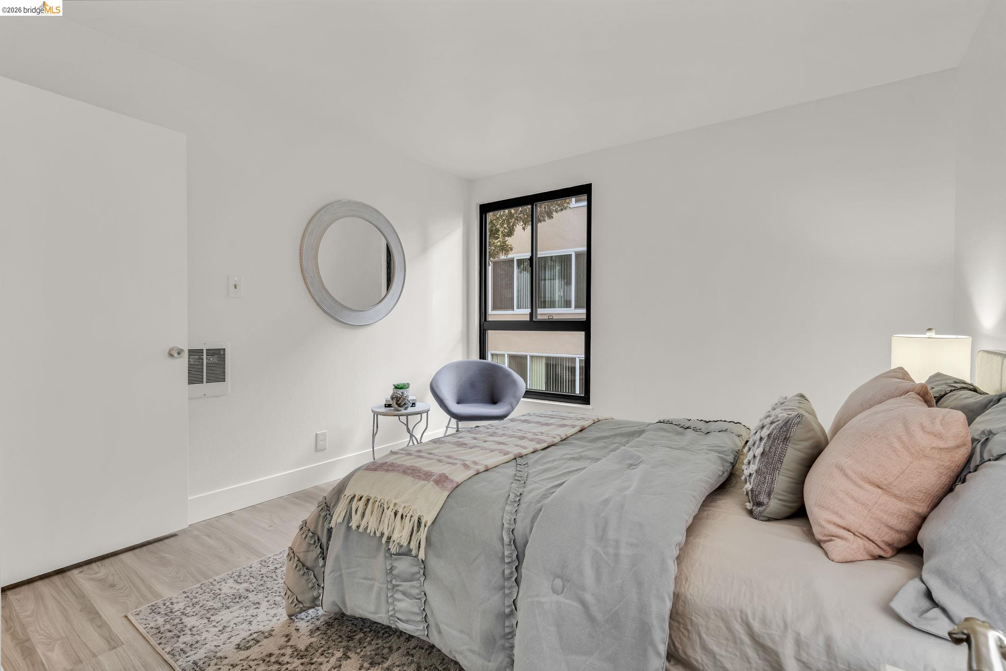 2632 Warring Street, Unit 3 Berkeley, CA 94704 - Photo 15 of 23 a bedroom with a bed and a window