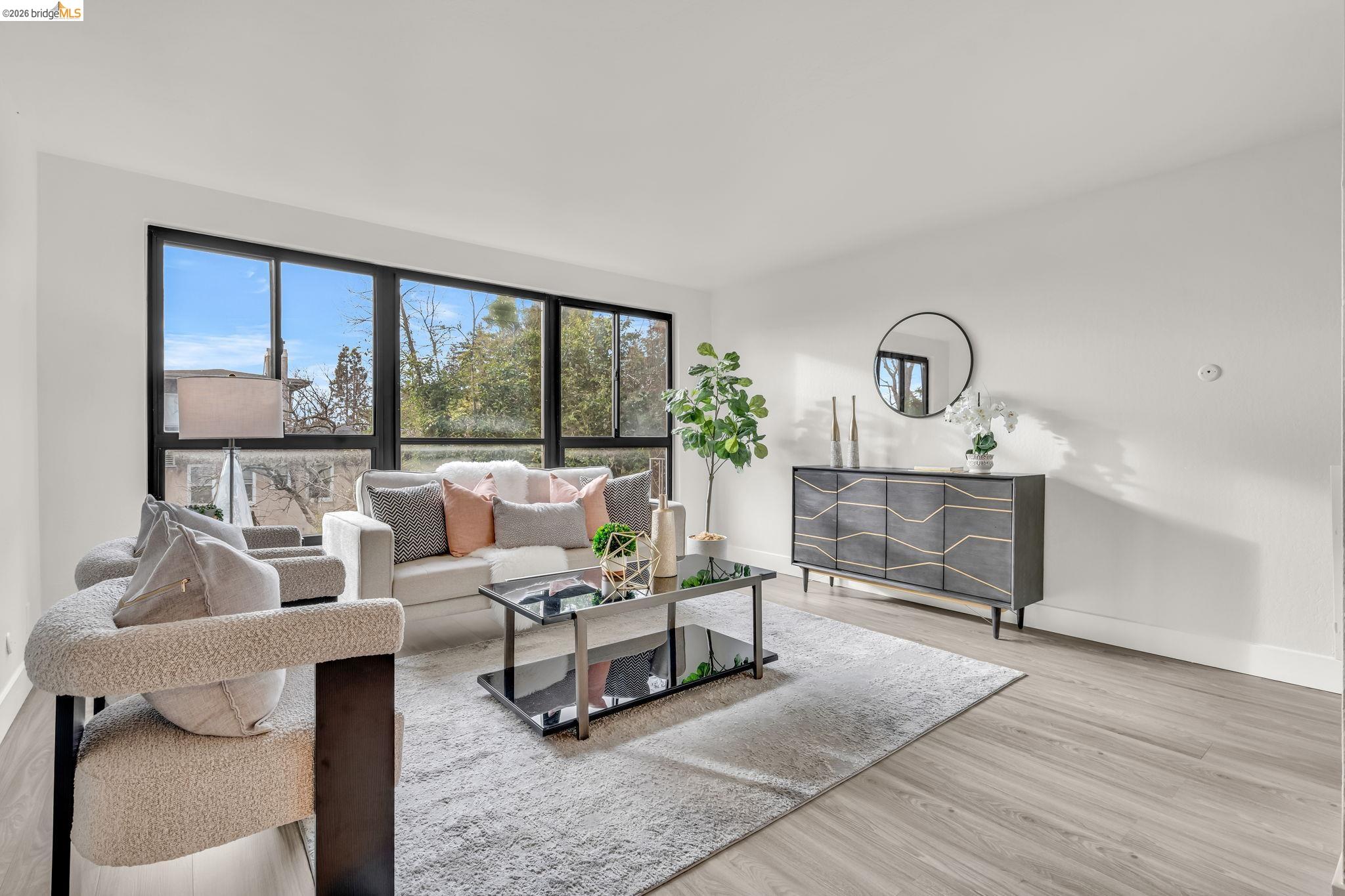 2632 Warring Street, Unit 3 Berkeley, CA 94704 - Photo 8 of 23 a living room with furniture and a floor to ceiling window