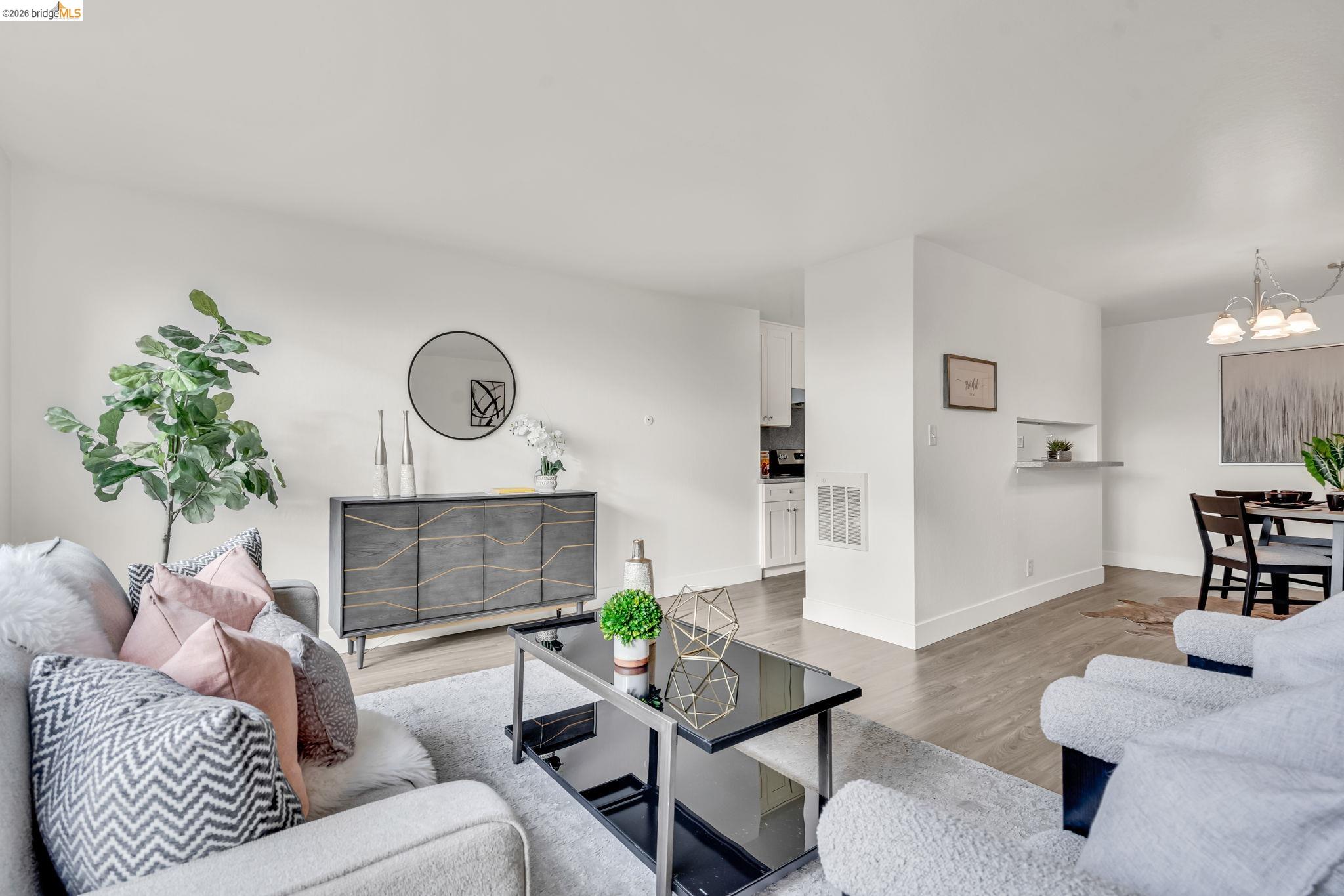 2632 Warring Street, Unit 3 Berkeley, CA 94704 - Photo 9 of 23 a living room with furniture and a fireplace