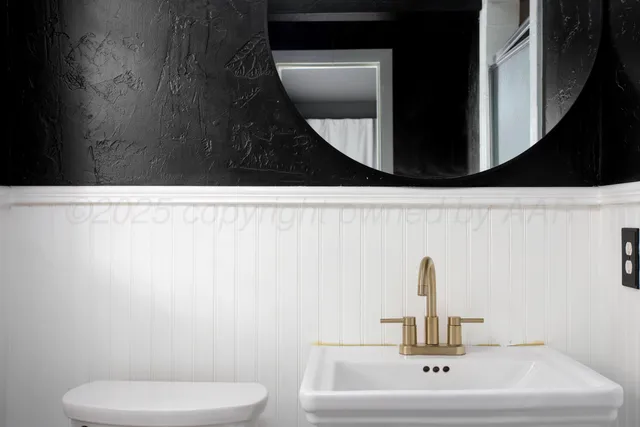 a bathroom with a toilet and a sink