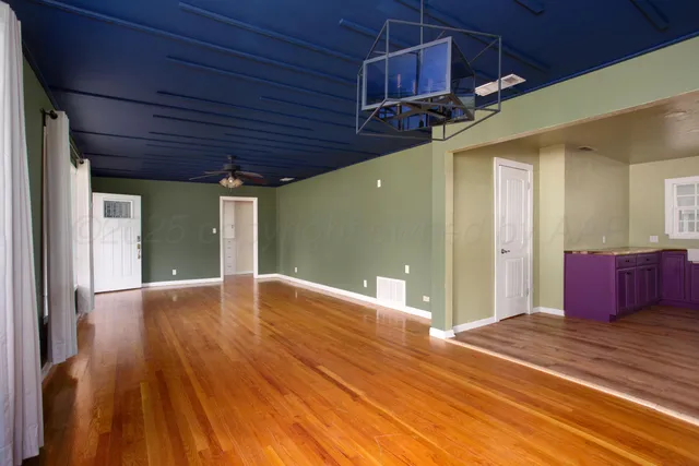 a view of a livingroom with wooden floor