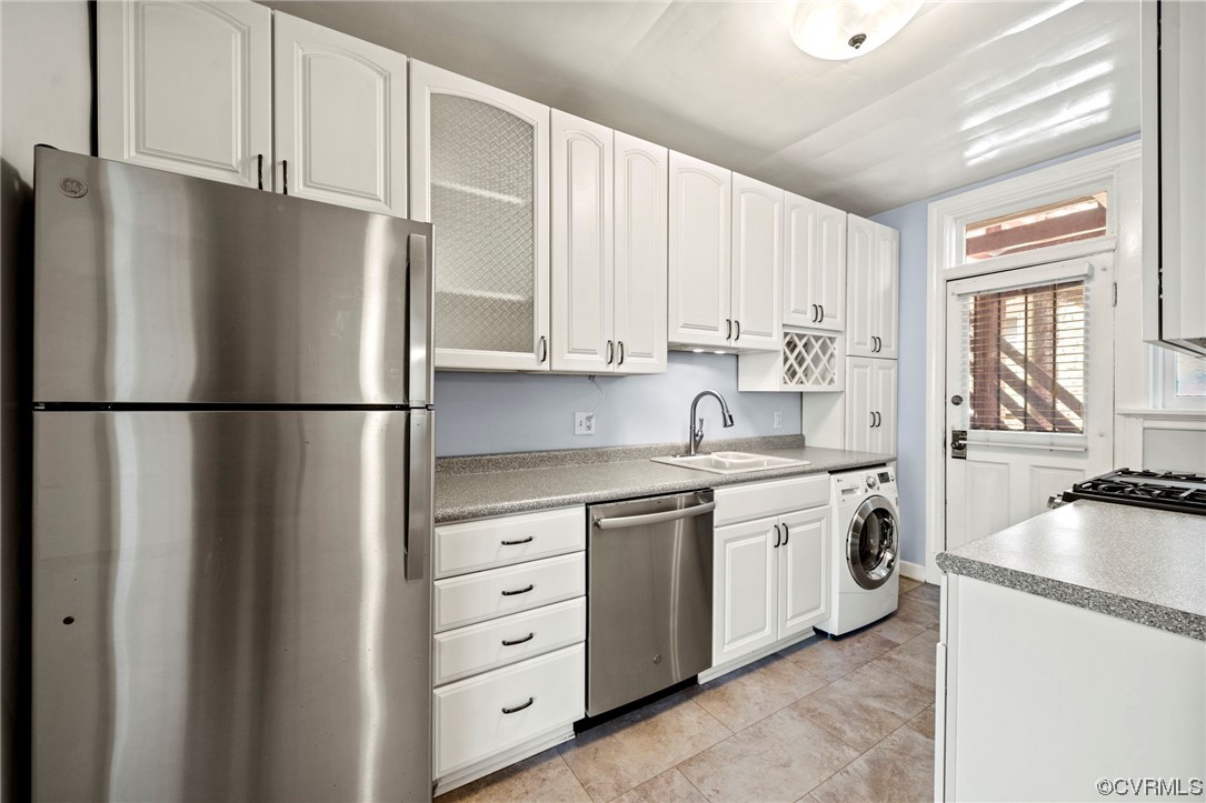 515 North Arthur Ashe Boulevard, Unit U9 Richmond, VA 23220 - Photo 9 of 18 a kitchen with stainless steel appliances granite countertop a refrigerator sink and cabinets