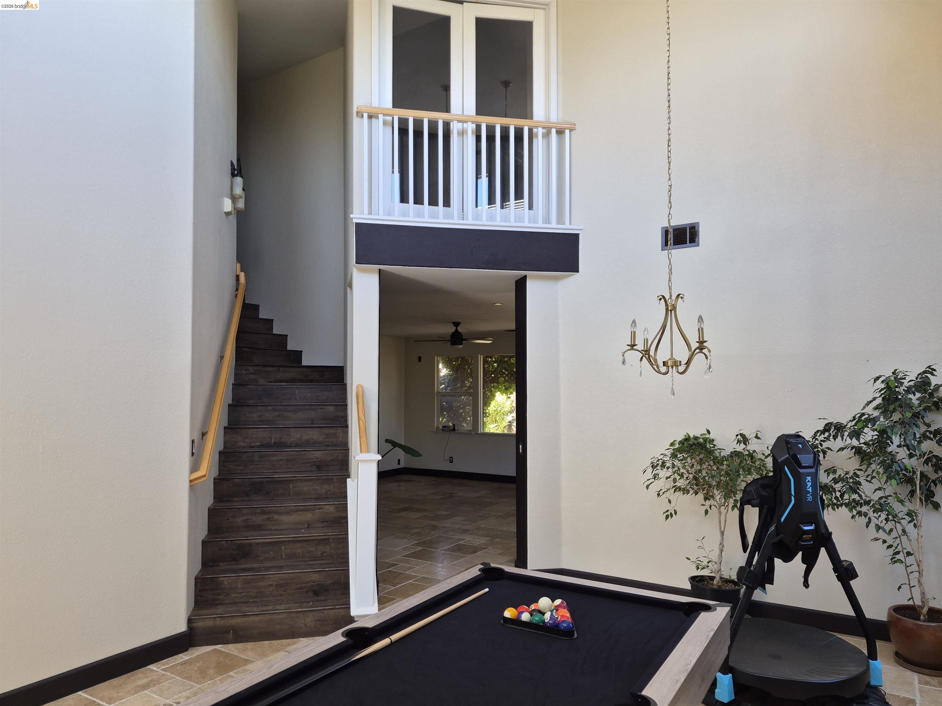 149 Oakpoint Court Bay Point, CA 94565 - Photo 20 of 22 Two-story foyer featuring a prominent staircase with wood-finish treads and a light wood handrail