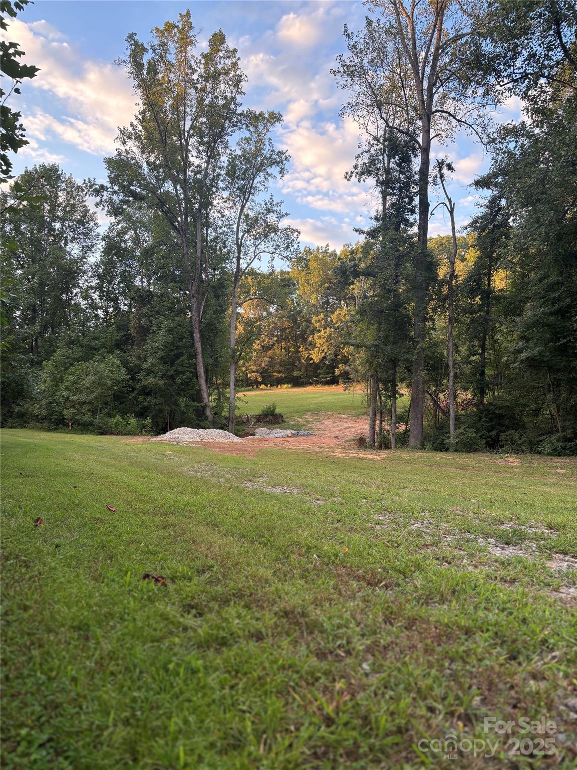 1770 London Road Mooresville, NC 28115 - Photo 1 of 12 a view of outdoor space with green field and trees all around