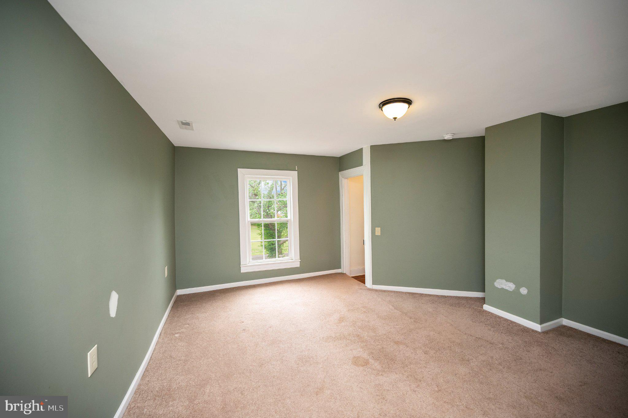 23202 Village Road Unionville, VA 22567 - Photo 36 of 58 a view of an empty room with a window