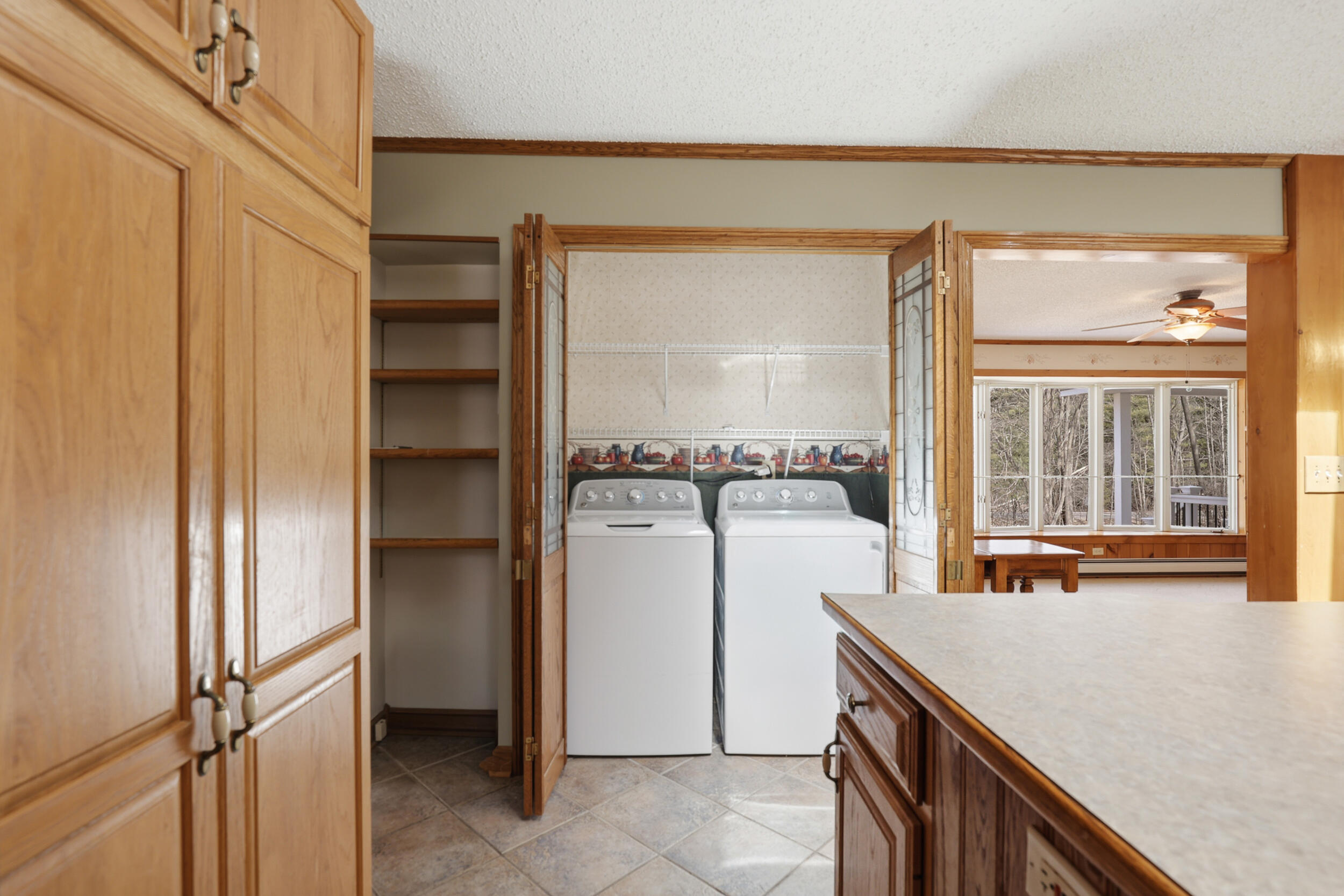 10319 East 4 1/2 Mile Road Luther, MI 49656 - Photo 12 of 61 Laundry in kitchen