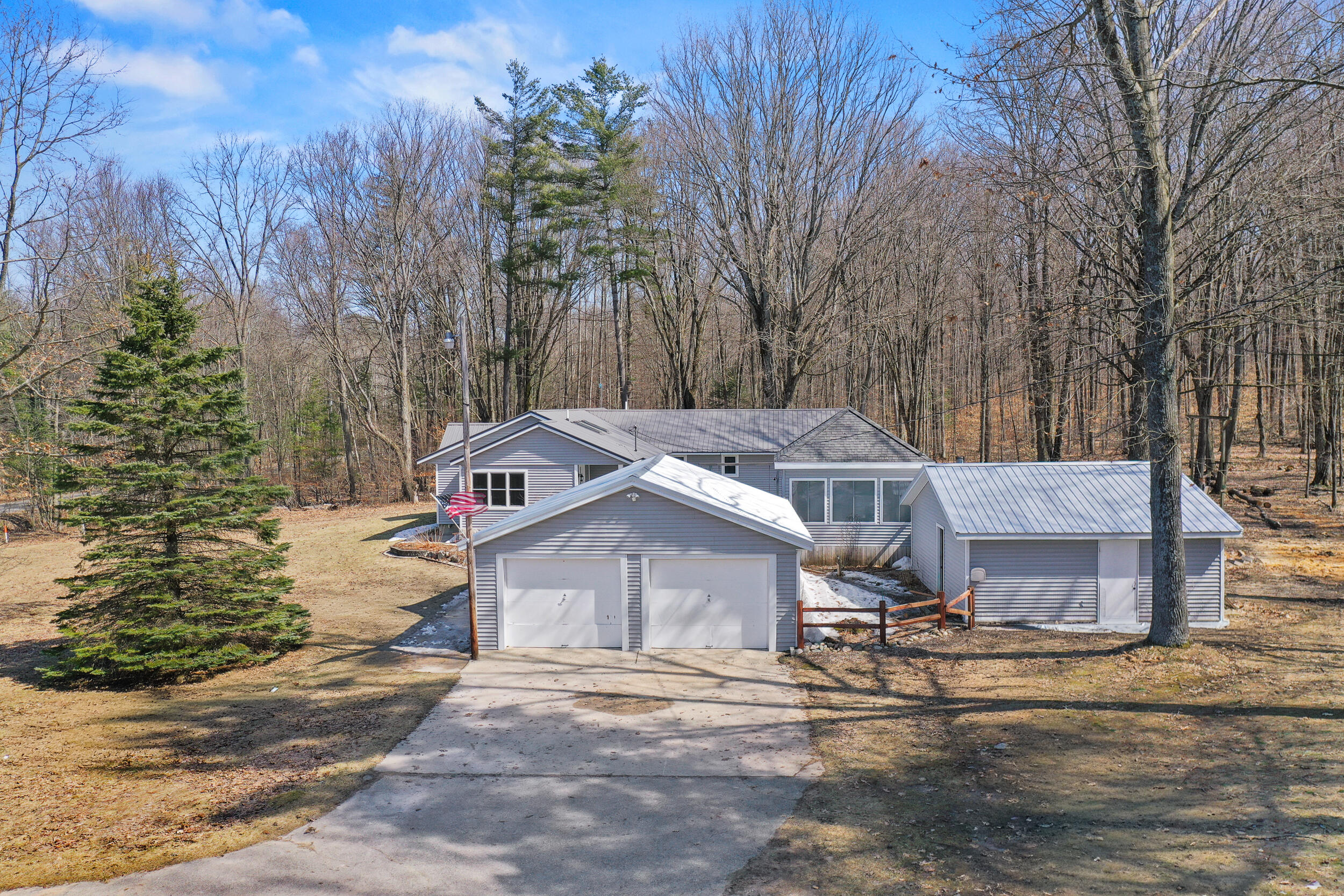 10319 East 4 1/2 Mile Road Luther, MI 49656 - Photo 56 of 62 View from garage side of home