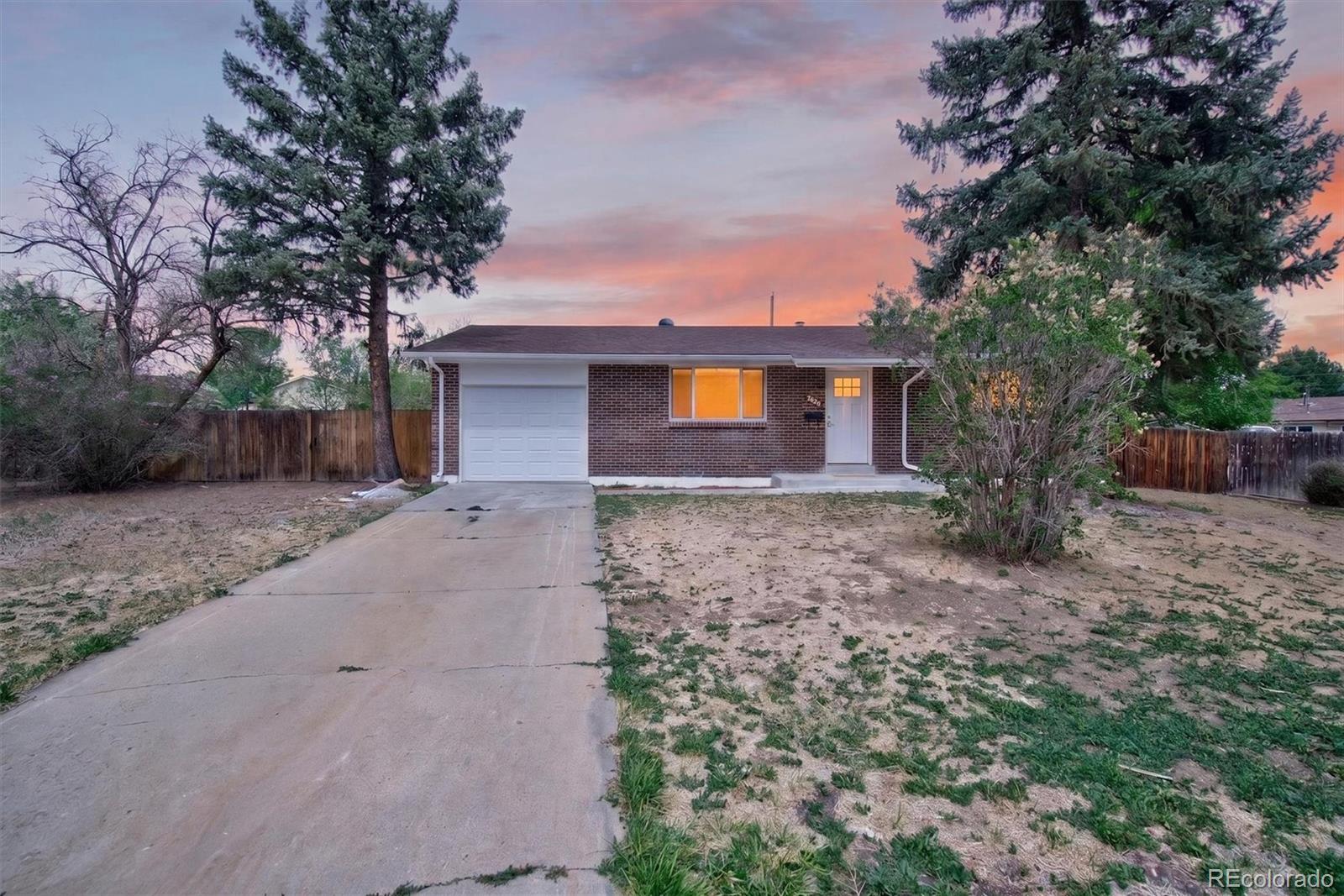 7620 Acoma Court Denver, CO 80221 - Photo 1 of 39 a front view of a house with a yard
