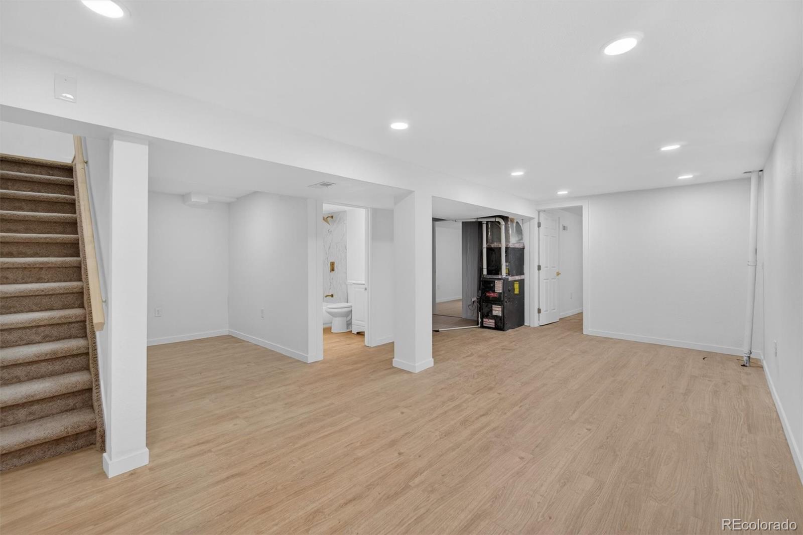 7620 Acoma Court Denver, CO 80221 - Photo 24 of 39 a view of an empty room with wooden floor