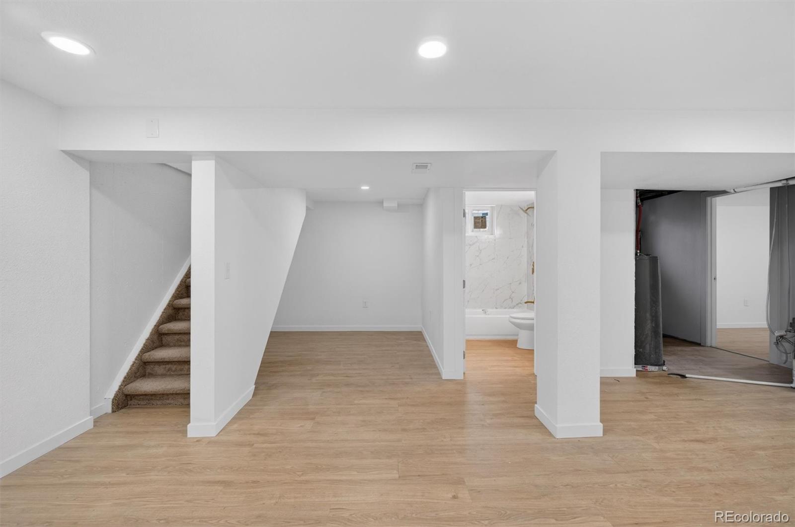7620 Acoma Court Denver, CO 80221 - Photo 25 of 39 wooden floor in an empty room with a gallery